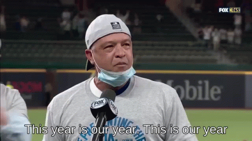 Man In Mask And Hat Saying This Year Is Our Year GIF