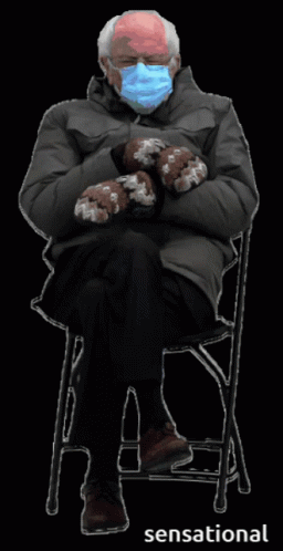 Man in Mask and Mittens Sitting in Chair