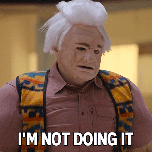 Man in Mask and Vest Saying I'm Not Doing It