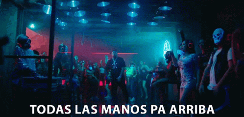 Man in Mask Dancing with Todas Las Manos Pa Arriba