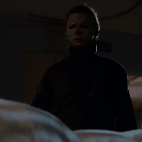 Man in Mask Holding Knife