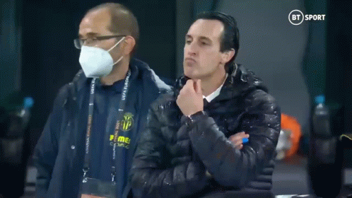 Man in Mask Next to Man in Puma Jacket