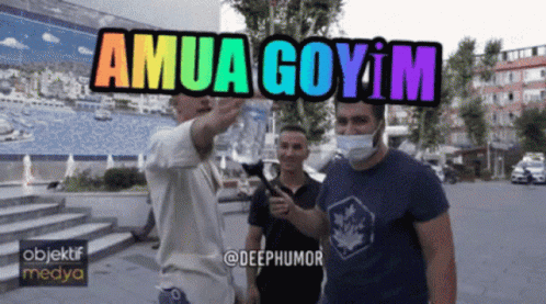 Man in Mask Pointing at Sign Saying Amua Goyim