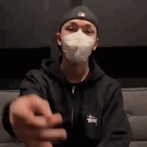 Man In Mask Sitting On Couch GIF
