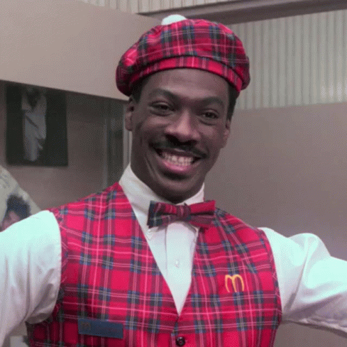 Man in McDonald's Vest and Hat Smiling