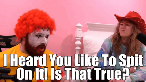 Man In McDonald's Wig Talking To Woman In Cowboy Hat GIF