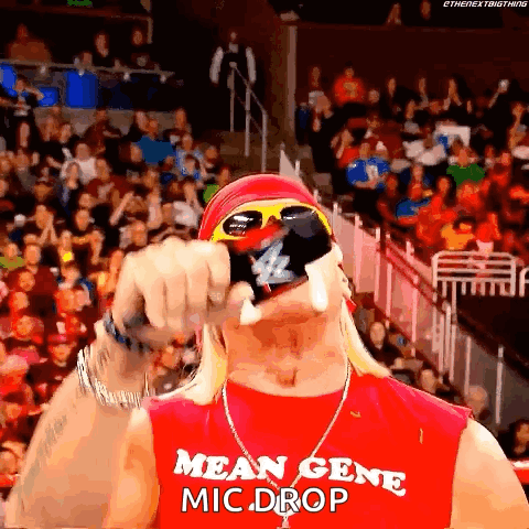 Man in Mean Gene Mic Drop Shirt