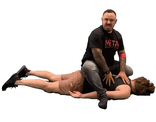 Man in Meta Shirt Sitting on Floor
