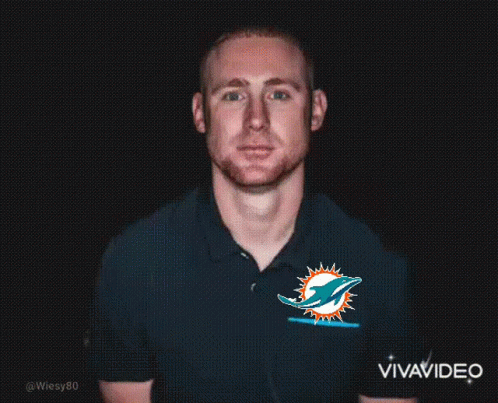 Man in Miami Dolphins Shirt in Dark