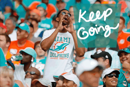 Man in Miami Dolphins Shirt Shouting in Crowd