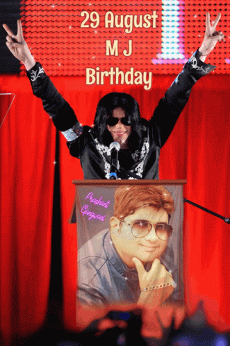 Man in Michael Jackson Costume at Podium With Arms Out