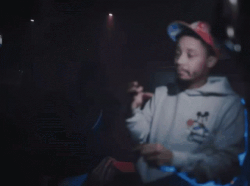 Man in Mickey Mouse Sweatshirt Pointing at Gun Saying I Got the on Me Right Now