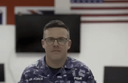 Man in Military Uniform and Glasses Looking at Camera