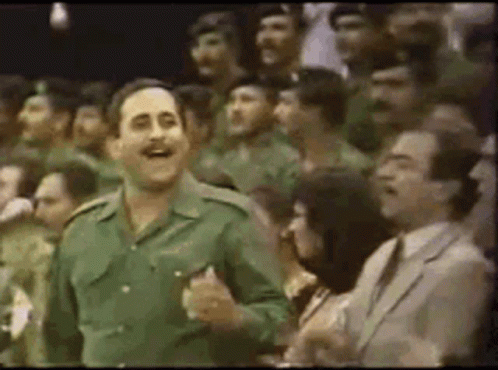Man in Military Uniform Dancing in Crowd