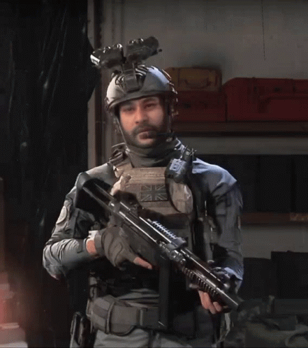 Man In Military Uniform Holding Gun GIF