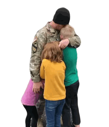 Man in Military Uniform Hugging Children