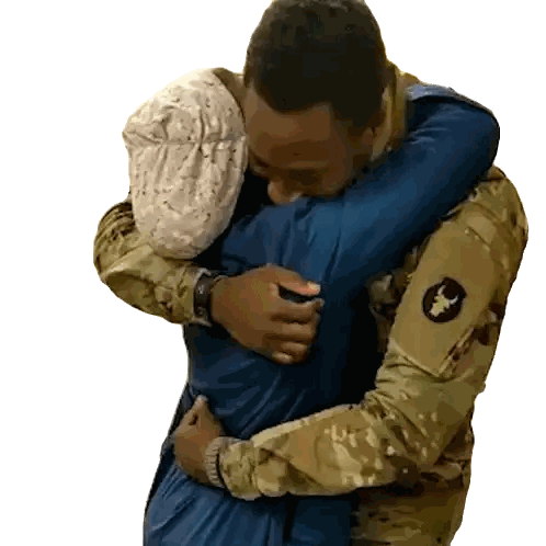 Man in Military Uniform Hugs Another