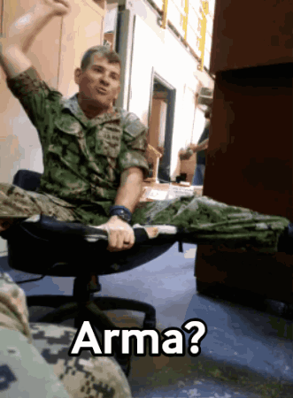 Man in Military Uniform in Office Chair with Arma