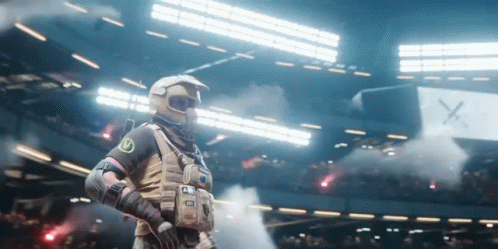 Man in Military Uniform in Stadium with Smoke