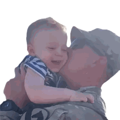 Man in Military Uniform Kissing Baby