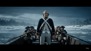 Man in Military Uniform Standing in Boat