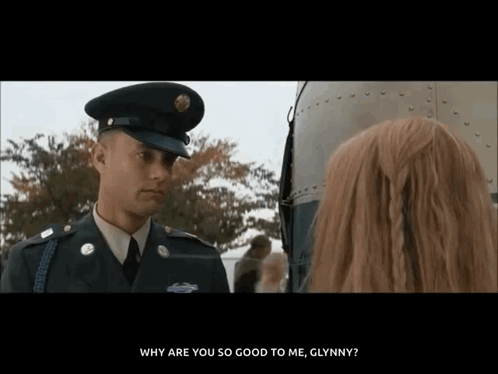 Man in Military Uniform Talking to Woman