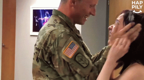 Man In Military Uniform Touching Woman Forehead GIF