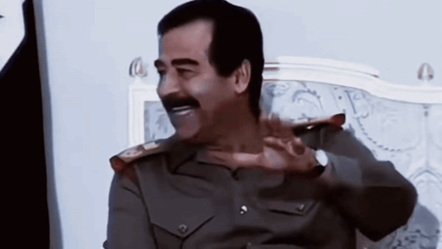 Man In Military Uniform With Mustache On Bed GIF