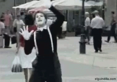 Man In Mime Costume Dancing On Street GIF