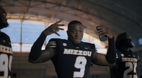 Man in Mizzou Jersey Taking Selfie