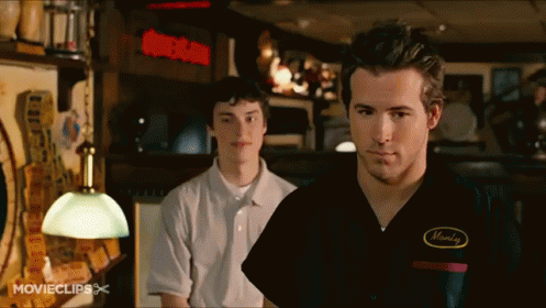 Man in Monday Shirt Next to Another Man