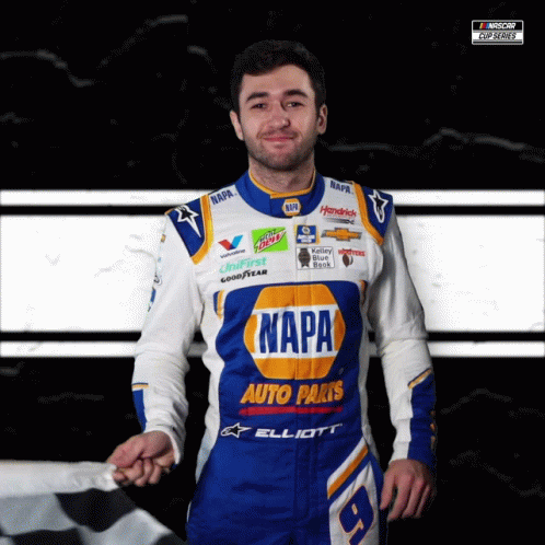 Man in Napa Auto Parts Uniform Holding Checkered Flag