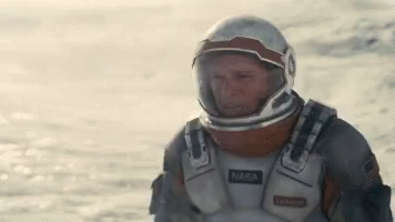 Man in NASA Space Suit in Desert