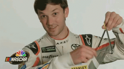 Man in Nascar Jacket Holding Scissors