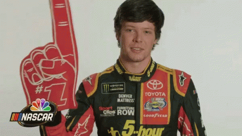 Man in NASCAR Uniform Holding Red Foam Finger