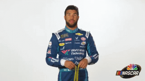 Man In NASCAR Uniform Holding Yellow Object GIF