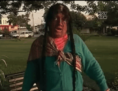 Man In Native American Costume Standing In Park With Hoy 9 PM GIF