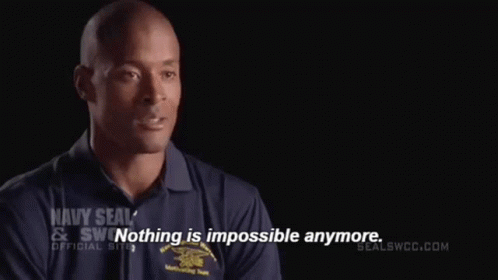 Man in Navy SEAL Shirt Saying Nothing Is Impossible Anymore
