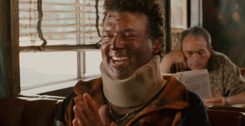 Man in Neck Brace Laughing and Clapping
