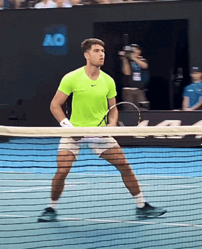 Man In Neon Green Shirt Holding Tennis Racquet GIF