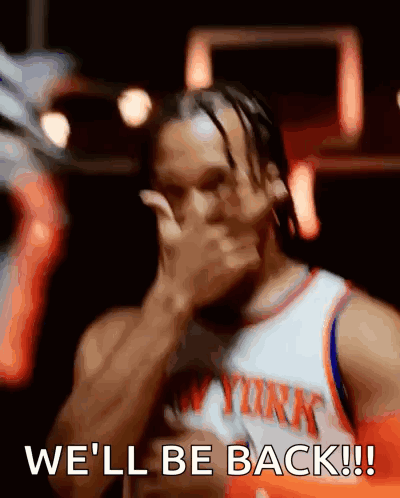 Man in New York Jersey Covering Face