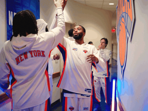 Man in New York Jersey Giving High Five