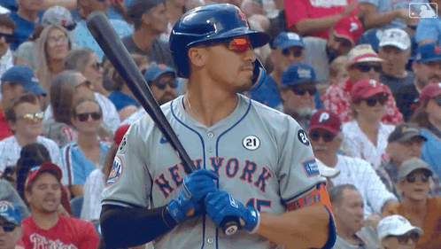 Man in New York Jersey Holding Baseball Bat
