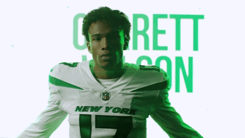 Man In New York Jets Jersey On Green Background GIF