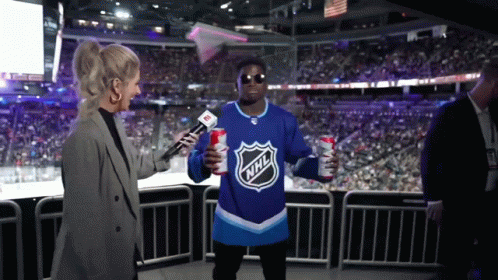 Man In NHL Jersey Interviewed By Reporter GIF