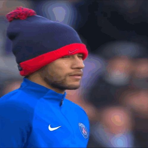 Man in Nike Hat and Blue Shirt