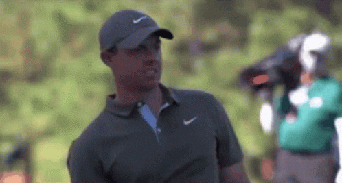 Man in Nike Hat and Polo Shirt on Golf Course