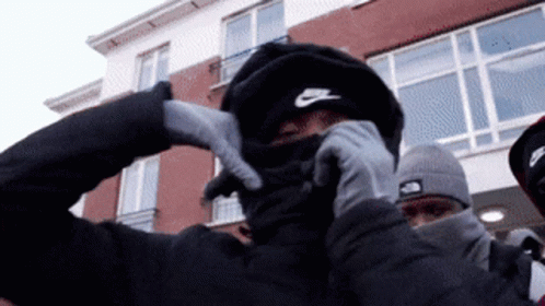 Man In Nike Hat Covering Face GIF