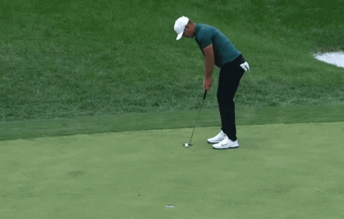 Man in Nike Hat Holding Golf Club
