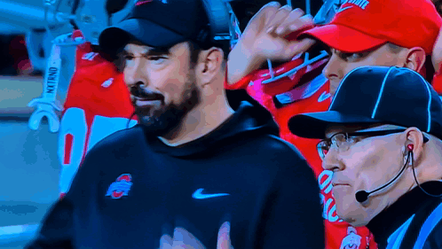 Man in Nike Hat Next to Man in Ohio State Hat